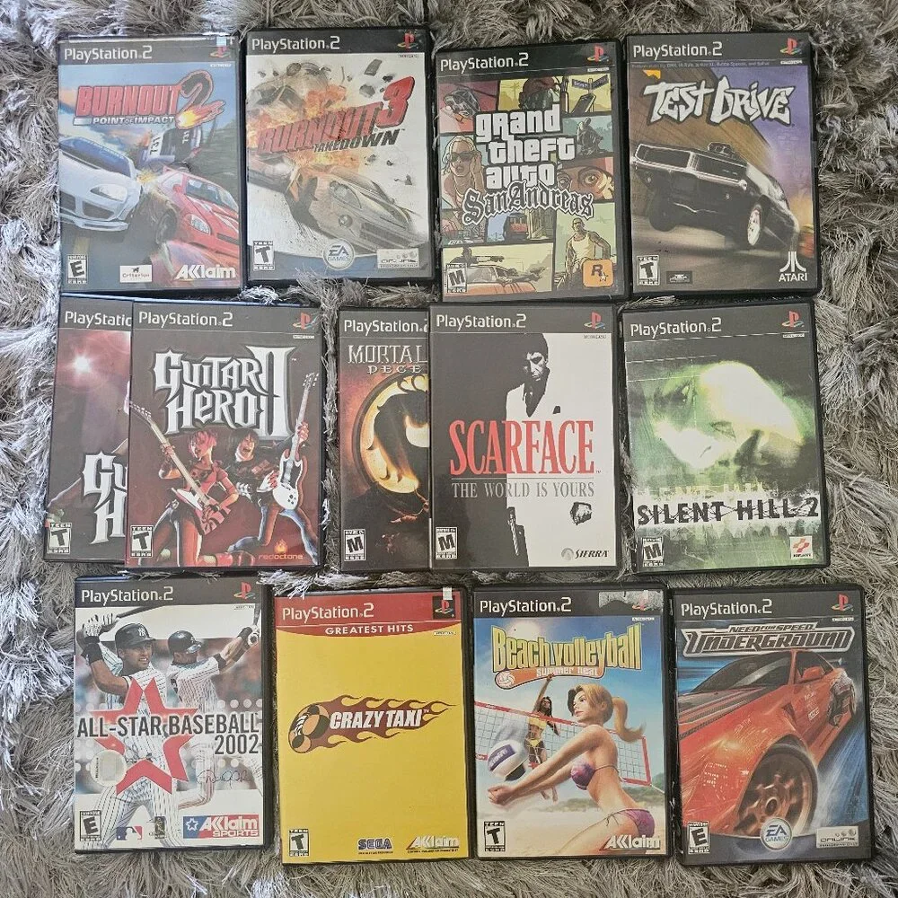 Playsation 2 (PS2 Fat) with controllers and games and PS2 Slim
